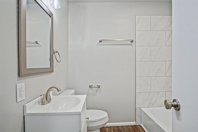 909 Buck Dr, Shawnee, OK 74801 - bathroom featuring vanity, wood finished floors, and bathtub / shower combination