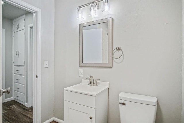 909 Buck Dr, Shawnee, OK 74801 - bathroom featuring vanity and wood finished floors