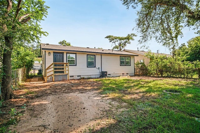 909 Buck Dr, Shawnee, OK 74801 - rear view of house with crawl space and a fenced backyard