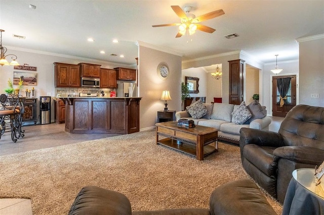 1106 Prairie Dunes Ct, Norman, OK 73072 - living room featuring a chandelier, ceiling fan, ornamental molding, light tile patterned floors, and light colored carpet