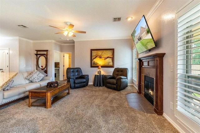 1106 Prairie Dunes Ct, Norman, OK 73072 - carpeted living room featuring ceiling fan, a fireplace, and crown molding