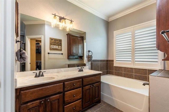 1106 Prairie Dunes Ct, Norman, OK 73072 - bathroom featuring tile patterned flooring, a garden tub, double vanity, crown molding, and a walk in closet
