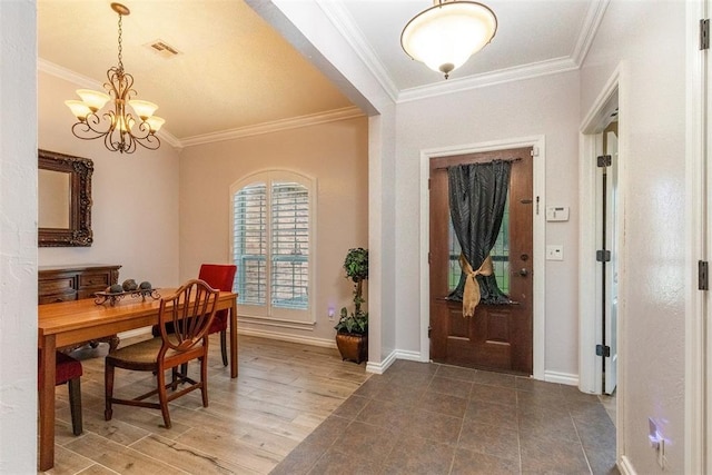 1106 Prairie Dunes Ct, Norman, OK 73072 - foyer entrance featuring ornamental molding and a chandelier