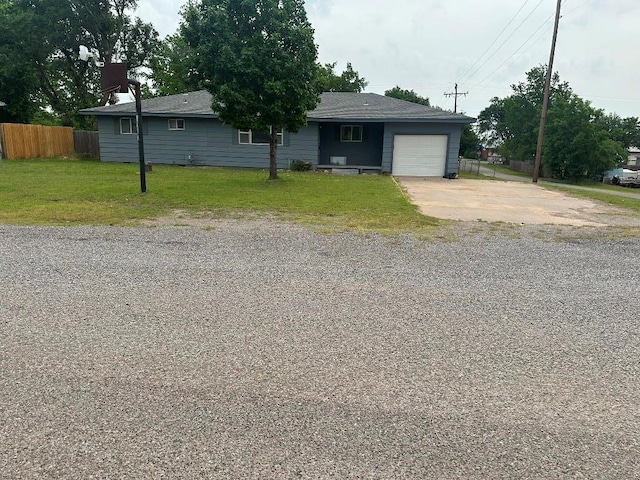 115 S Main St, Sharon, OK 73857 - ranch-style house featuring a garage and concrete driveway