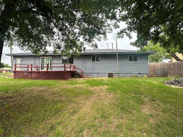 115 S Main St, Sharon, OK 73857 - rear view of house with crawl space and a wooden deck