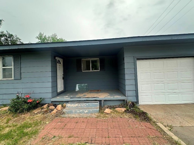 115 S Main St, Sharon, OK 73857 - entrance to property with an attached garage