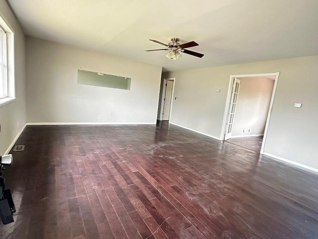 115 S Main St, Sharon, OK 73857 - unfurnished living room featuring ceiling fan and wood finished floors