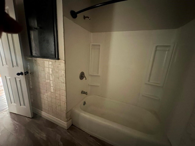 115 S Main St, Sharon, OK 73857 - full bath featuring washtub / shower combination and wood finished floors