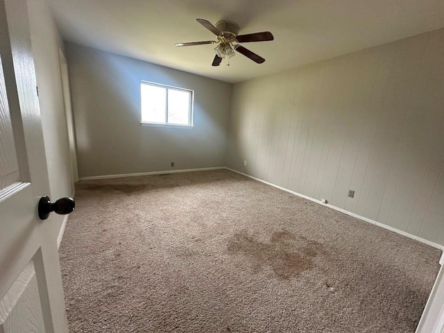 115 S Main St, Sharon, OK 73857 - carpeted empty room with ceiling fan