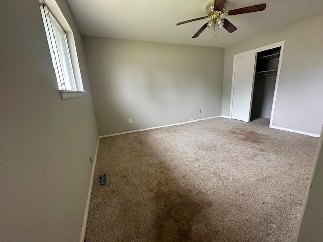 115 S Main St, Sharon, OK 73857 - unfurnished bedroom with carpet flooring, a closet, and a ceiling fan