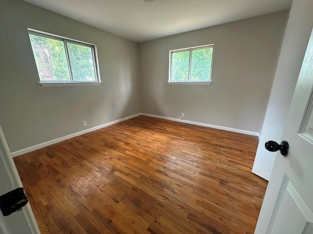 115 S Main St, Sharon, OK 73857 - empty room featuring hardwood / wood-style flooring