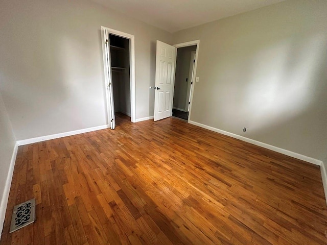 115 S Main St, Sharon, OK 73857 - unfurnished bedroom with wood finished floors and a closet