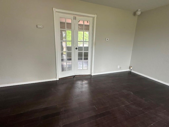 115 S Main St, Sharon, OK 73857 - spare room featuring french doors and dark wood-style floors