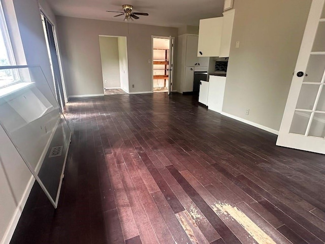 115 S Main St, Sharon, OK 73857 - unfurnished living room with ceiling fan and dark wood-style flooring