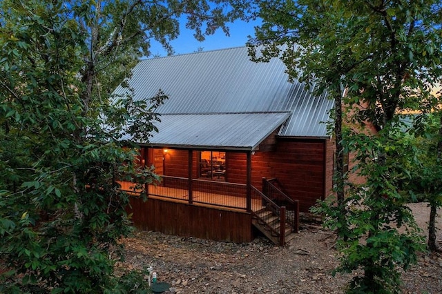 708 Split Creek Ln, Broken Bow, OK 74728 - rear view of property with covered porch, a metal roof, and stairway