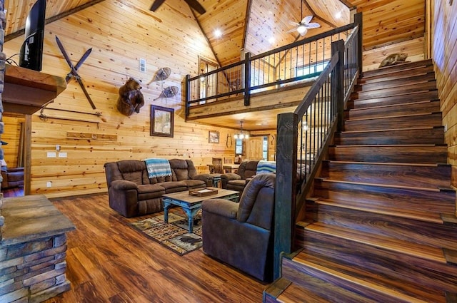 708 Split Creek Ln, Broken Bow, OK 74728 - living area with a ceiling fan, high vaulted ceiling, stairway, wooden walls, and dark wood finished floors