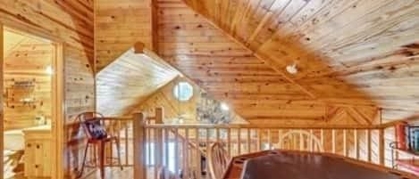 708 Split Creek Ln, Broken Bow, OK 74728 - additional living space with lofted ceiling, wood ceiling, and wooden walls