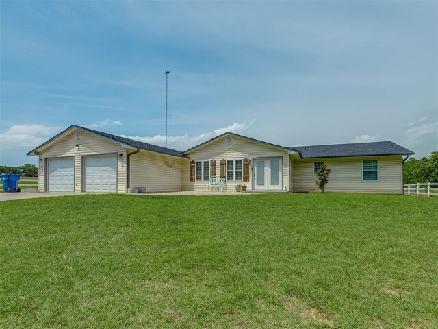 111 E Memorial, Marlow, OK 73055 - ranch-style home featuring an attached garage, french doors, and driveway