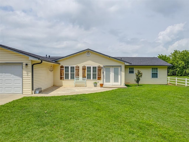 111 E Memorial, Marlow, OK 73055 - rear view of property with a garage, roof with shingles, and a patio area
