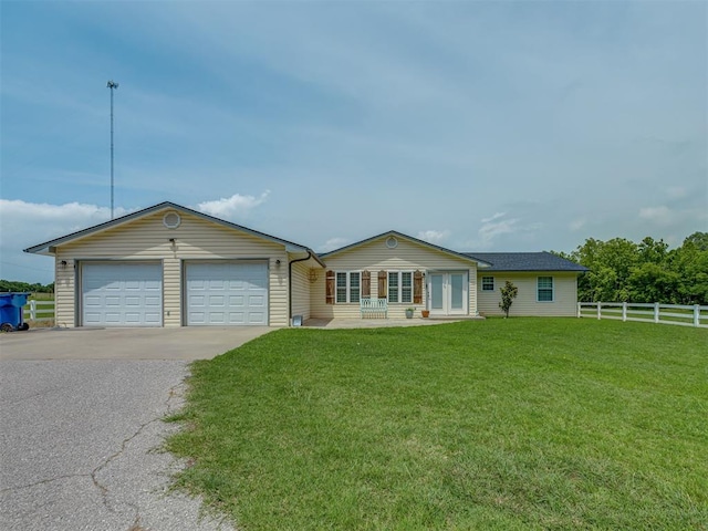 111 E Memorial, Marlow, OK 73055 - ranch-style home featuring french doors, a garage, and asphalt driveway