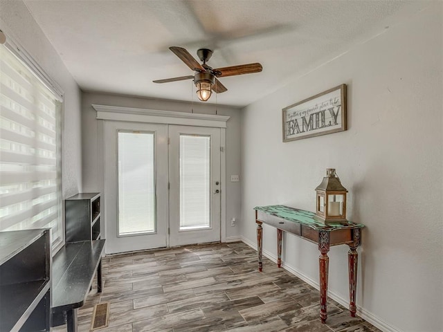 111 E Memorial, Marlow, OK 73055 - foyer with a ceiling fan and wood finished floors