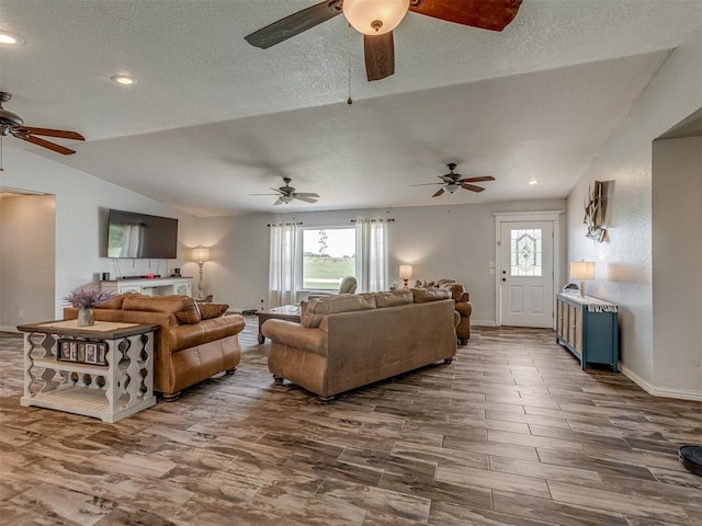 111 E Memorial, Marlow, OK 73055 - living room featuring lofted ceiling, a ceiling fan, healthy amount of natural light, dark wood-style floors, and recessed lighting