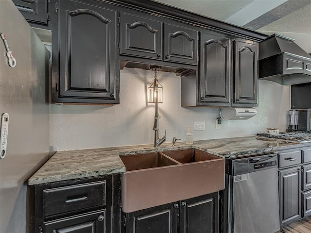 111 E Memorial, Marlow, OK 73055 - kitchen featuring stainless steel appliances, wall chimney range hood, and dark cabinetry
