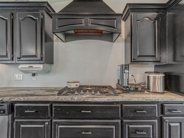 111 E Memorial, Marlow, OK 73055 - kitchen with stainless steel appliances, wall chimney exhaust hood, and dark cabinets