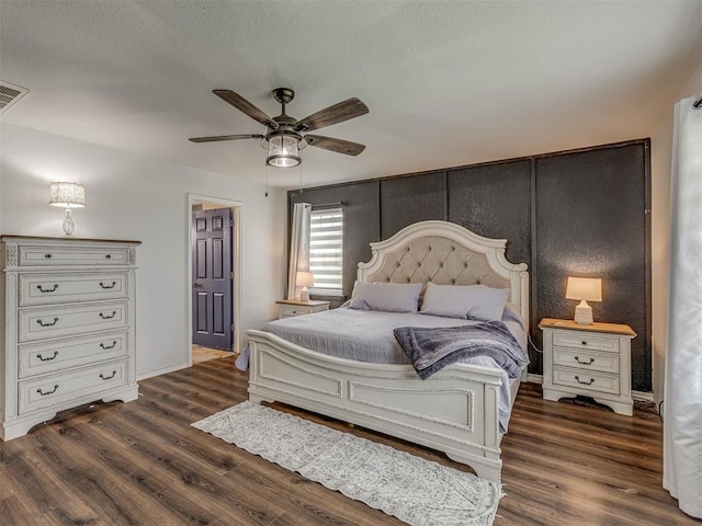 111 E Memorial, Marlow, OK 73055 - bedroom featuring dark wood finished floors and a ceiling fan