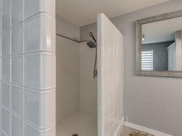111 E Memorial, Marlow, OK 73055 - bathroom featuring tiled shower and baseboards