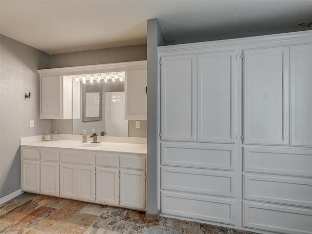 111 E Memorial, Marlow, OK 73055 - bathroom with vanity and baseboards