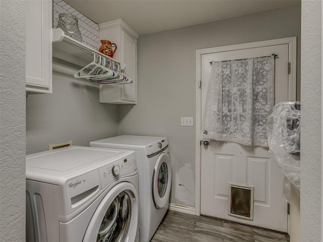111 E Memorial, Marlow, OK 73055 - laundry room featuring washing machine and clothes dryer, wood finished floors, and cabinet space