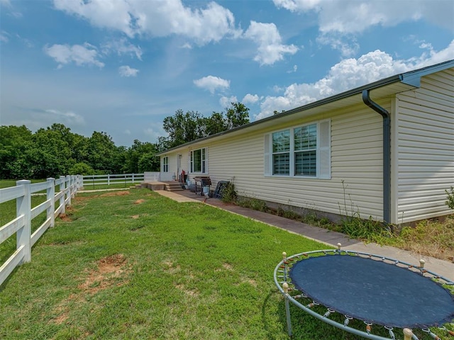 111 E Memorial, Marlow, OK 73055 - view of yard featuring a trampoline and a patio area