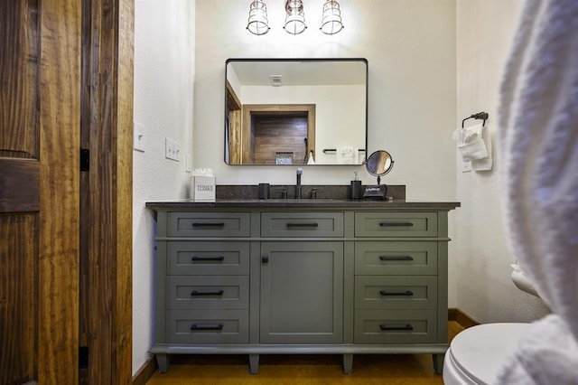 99 Sawtooth Pine Rd, Broken Bow, OK 74728 - half bathroom featuring vanity and toilet