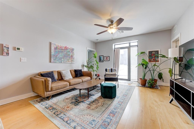 444 N Central Ave Unit 106, Oklahoma City, OK 73104 - living area with light wood finished floors and ceiling fan