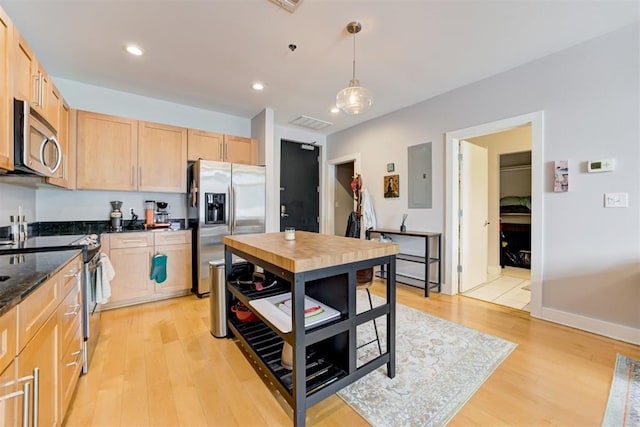 444 N Central Ave Unit 106, Oklahoma City, OK 73104 - kitchen with appliances with stainless steel finishes, light brown cabinets, light wood-style flooring, hanging light fixtures, and recessed lighting