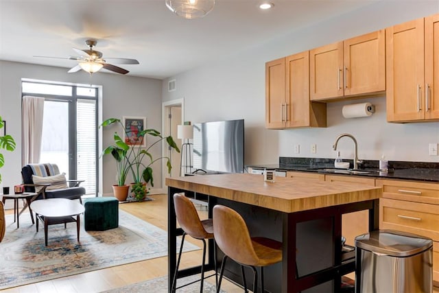 444 N Central Ave Unit 106, Oklahoma City, OK 73104 - kitchen with wooden counters, fridge, light brown cabinetry, ceiling fan, and recessed lighting