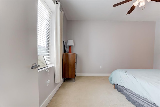 444 N Central Ave Unit 106, Oklahoma City, OK 73104 - bedroom featuring light colored carpet and ceiling fan