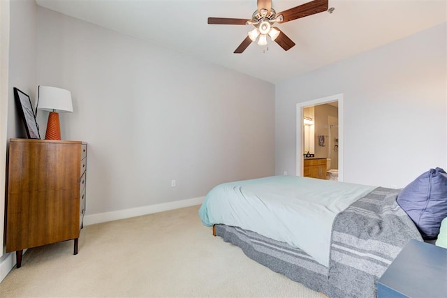 444 N Central Ave Unit 106, Oklahoma City, OK 73104 - bedroom with light colored carpet, connected bathroom, and ceiling fan
