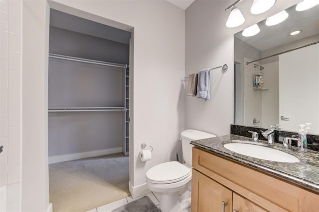 444 N Central Ave Unit 106, Oklahoma City, OK 73104 - full bath featuring vanity, a shower, a walk in closet, and tile patterned floors