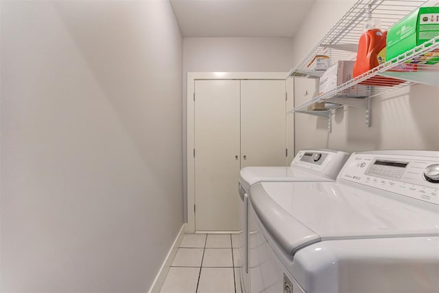 444 N Central Ave Unit 106, Oklahoma City, OK 73104 - laundry area featuring washer and dryer and light tile patterned floors