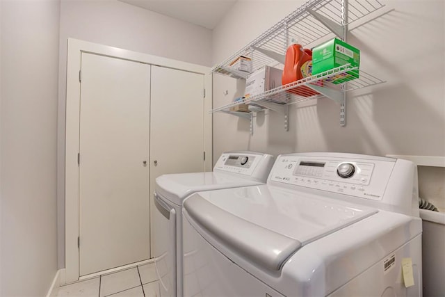 444 N Central Ave Unit 106, Oklahoma City, OK 73104 - laundry area featuring washing machine and clothes dryer and light tile patterned floors
