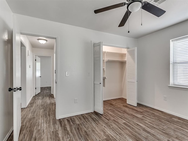 209 SW 6th St, Blanchard, OK 73010 - unfurnished bedroom with wood finished floors, a closet, and a ceiling fan