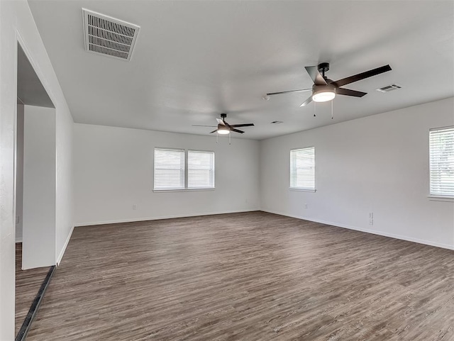 209 SW 6th St, Blanchard, OK 73010 - empty room featuring ceiling fan and dark wood-style flooring
