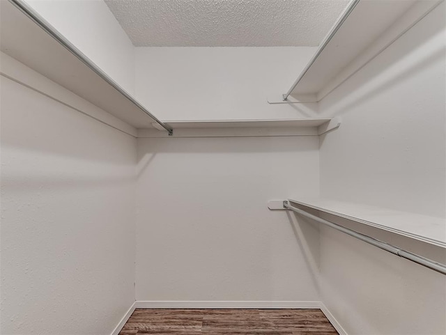 209 SW 6th St, Blanchard, OK 73010 - spacious closet featuring wood finished floors