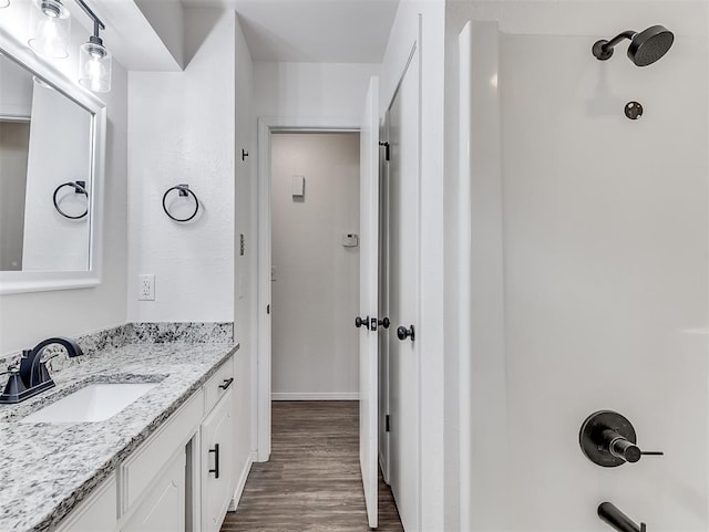 209 SW 6th St, Blanchard, OK 73010 - bathroom featuring vanity, wood finished floors, and a shower