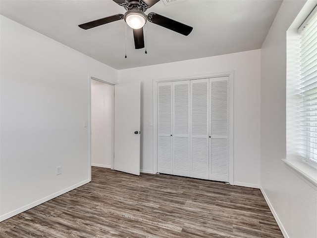 209 SW 6th St, Blanchard, OK 73010 - unfurnished bedroom featuring wood finished floors, a closet, and a ceiling fan