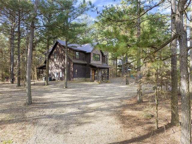 318 Camp Ranch Rd, Broken Bow, OK 74728 - view of side of property featuring a metal roof