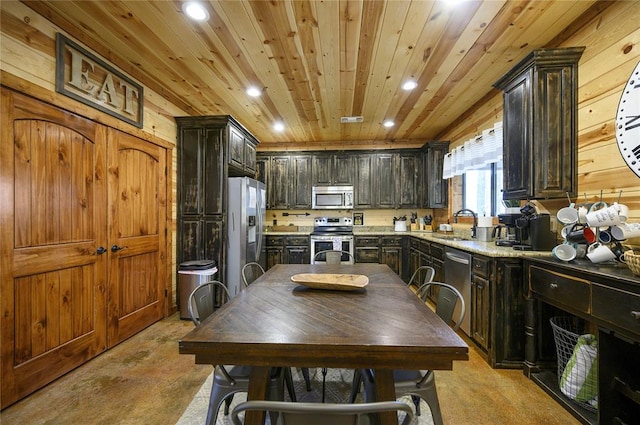 318 Camp Ranch Rd, Broken Bow, OK 74728 - kitchen with stainless steel appliances, recessed lighting, wood ceiling, and wood walls