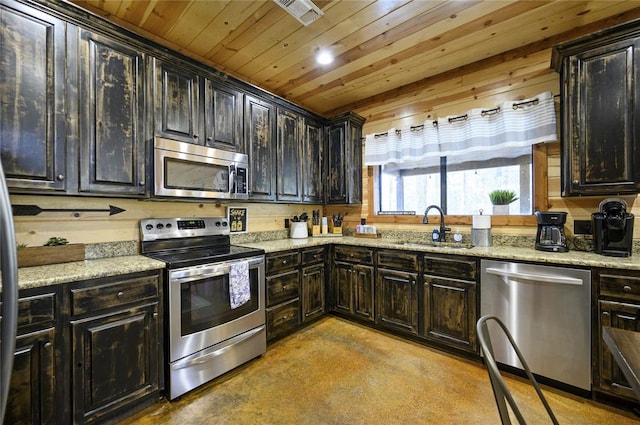 318 Camp Ranch Rd, Broken Bow, OK 74728 - kitchen featuring appliances with stainless steel finishes, concrete floors, wooden ceiling, and light stone counters